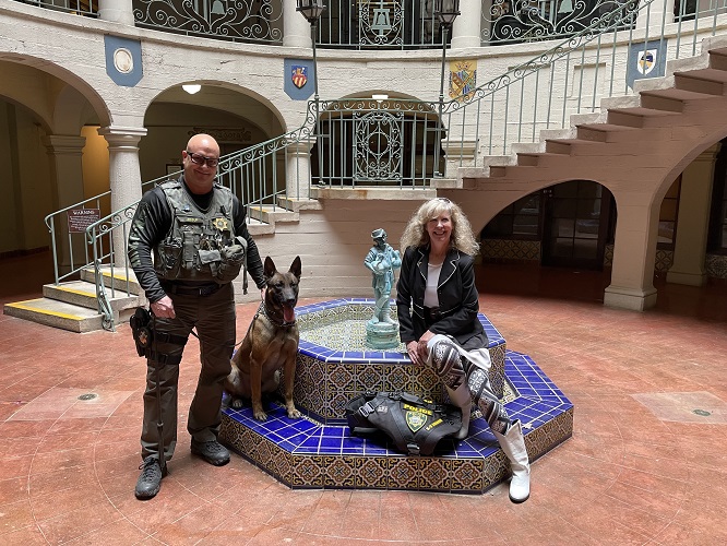 State Hospital Patton Police K9 Nico and Officer Jessup with K9 Armor cofounder Suzanne Saunders donating his vest