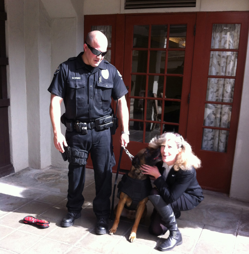 Hemet PD Officer Matt Gomez and K9 Jack giving kisses to K9 Armor Cofounder Suzanne Saunders