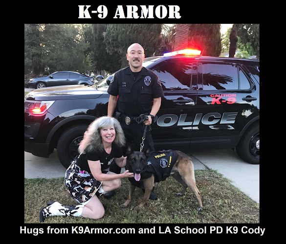 Hugs from Suzanne Saunders, cofounder K9 Armor and LA School PD K9 Cody and Officer Yau, photo by Sgt Arambulo
