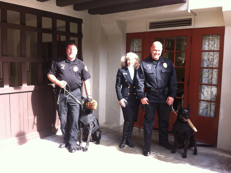 Riverside PD Officer Brad Smith with K9 Finn and Officer Darrel Hill with K9 Noran and K9 Armor cofounder Suzanne Saunders