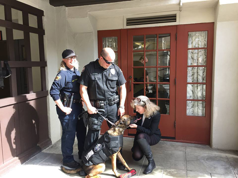 Riverside County Animal Control Officer Tiffany FullerHemet with PD Officer Matt Gomez and K9 Jack giving kisses to K9 Armor Cofounder Suzanne Saunders