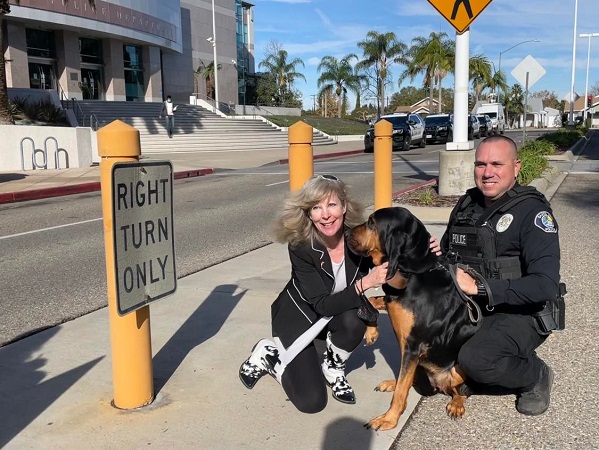 Hugs from K9 Armor cofounder Suzanne and Santa Ana Police K9 Rosie and Officer Guidry