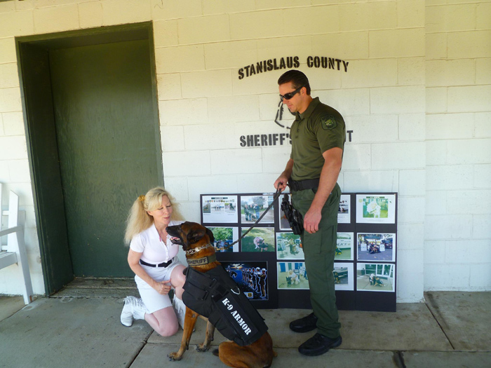 K9 Armor Cofounder Suzanne Saunders with Stanislaus County Sheriff K9 Smoke and Deputy Thompson
