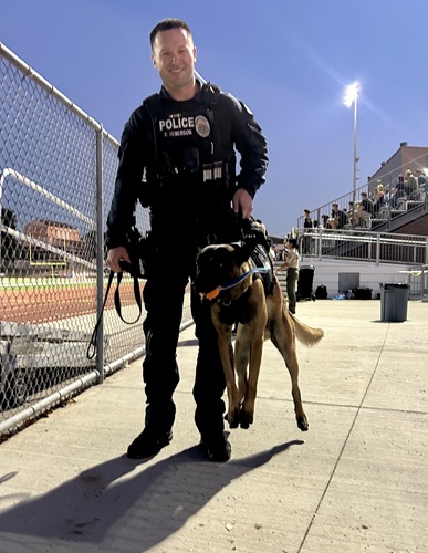 Smiles from Anaheim PD Officer Hemerson giving a lift to K9 Creed in his new K9 Armor vest at the OCPCA 2025 show Smiles from Anaheim PD Officer Hemerson giving a lift to K9 Creed in his new K9 Armor vest at the OCPCA 2025 show